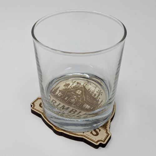 Wood coaster with glass for scale